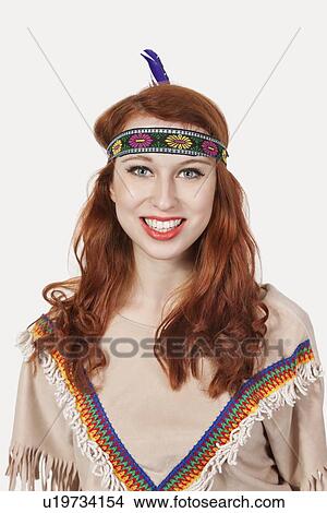 Portrait of young woman dressed in old-fashioned costume smiling against gray background View Large Photo Image Picture - Portrait of young woman dressed in old-fashioned costume smiling against gray background. Fotosearch