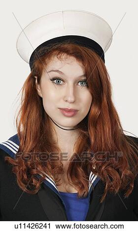 Portrait of young woman in sailor's uniform against gray background View Large Photo Image Stock Image - Portrait of young woman in sailor's uniform against gray background. Fotosearch
