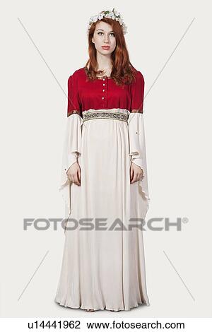 Portrait of young woman in old-fashioned princess costume against gray background View Large Photo Image Stock Image - Portrait of young woman in old-fashioned princess costume against gray background. Fotosearch