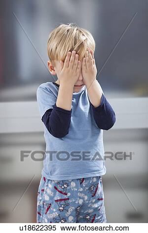 Scared little boy in casuals with hands over his eyes View Large Photo Image Stock Photography - Scared little boy in casuals with hands over his eyes. Fotosearch