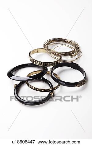 Set of traditional bangles over white background View Large Photo Image Stock Photo - Set of traditional bangles over white background. Fotosearch