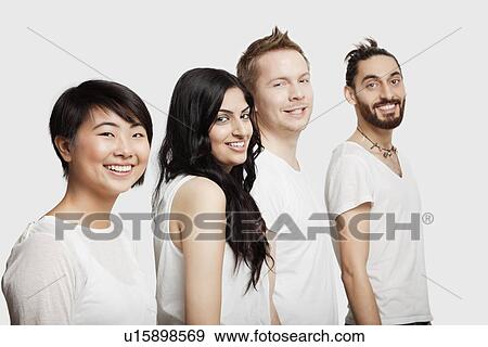 Side view of young multi-ethnic friends in casuals smiling over white background View Large Photo Image Stock Photo - Side view of young multi-ethnic friends in casuals smiling over white background. Fotosearch