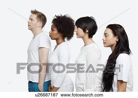 Stock Photo - Side view of young multi-ethnic friends in casuals standing in line over white background. Fotosearch