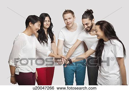 Side view of young multi-ethnic friends in casuals over white background View Large Photo Image Stock Photograph - Side view of young multi-ethnic friends in casuals over white background. Fotosearch