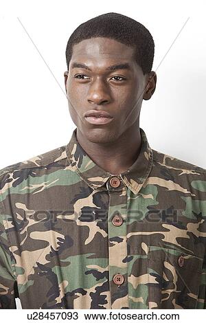 Thoughtful young military soldier in camouflage clothing looking away over white background View Large Photo Image Stock Image - Thoughtful young military soldier in camouflage clothing looking away over white background. Fotosearch