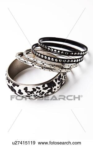Trendy bangles over white background View Large Photo Image Stock Photo - Trendy bangles over white background. Fotosearch