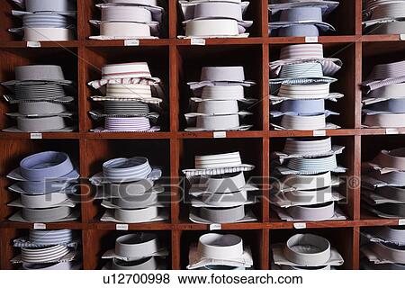 Variety of shirts on shelves in a clothing store View Large Photo Image Stock Photo - Variety of shirts on shelves in a clothing store. Fotosearch