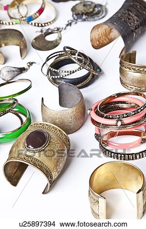 Variety of traditional bangles and bracelets over white background View Large Photo Image Picture - Variety of traditional bangles and bracelets over white background. Fotosearch