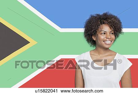 Young African American woman in white t-shirt smiling against South African flag View Large Photo Image Stock Image - Young African American woman in white t-shirt smiling against South African flag. Fotosearch