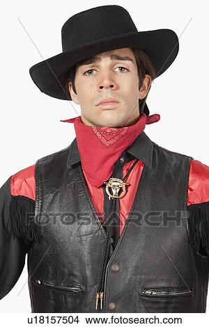 Young cowboy in black leather vest against white background View Large Photo Image Picture - Young cowboy in black leather vest against white background. Fotosearch