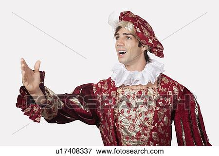 Young man in old-fashioned costume against gray background View Large Photo Image Stock Photo - Young man in old-fashioned costume against gray background. Fotosearch