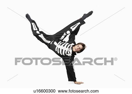 Young man in skeleton costume break dancing against white background View Large Photo Image Stock Image - Young man in skeleton costume break dancing against white background. Fotosearch