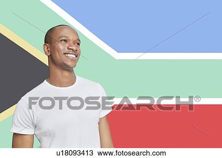 Young man in white t-shirt day dreaming against South African flag View Large Photo Image Stock Image - Young man in white t-shirt day dreaming against South African flag. Fotosearch