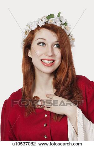 Young woman in old-fashioned princess costume looking away against gray background View Large Photo Image Stock Image - Young woman in old-fashioned princess costume looking away against gray background. Fotosearch