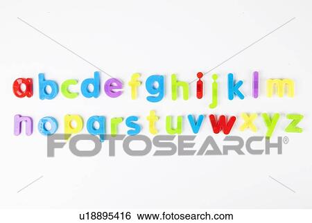 Stock Photograph - Alphabet magnets arranged in order over white background. Fotosearch