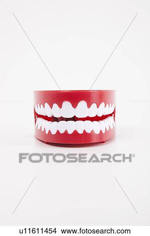 Artificial dentures over white background View Large Photo Image Picture - Artificial dentures over white background. Fotosearch