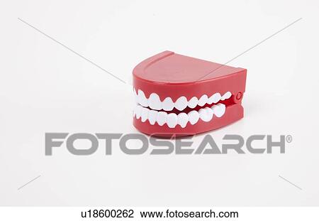Artificial dentures over white background View Large Photo Image Stock Image - Artificial dentures over white background. Fotosearch