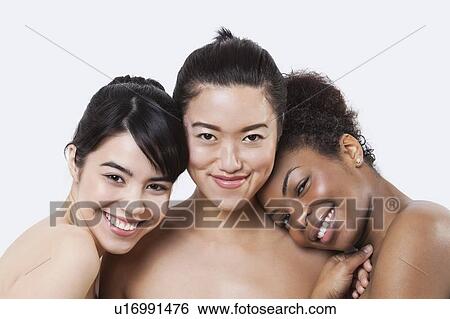 Stock Photograph - Beauty portrait of happy young multi-ethnic women over white background. Fotosearch
