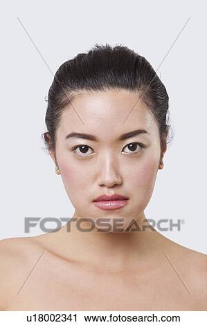 Beauty portrait of smiling young Chinese woman over white background View Large Photo Image Stock Image - Beauty portrait of smiling young Chinese woman over white background. Fotosearch