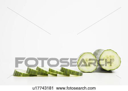 Close-up of cucumber with slices View Large Photo Image Stock Image - Close-up of cucumber with slices. Fotosearch