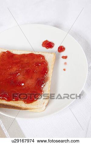 Close-up of jam spread on slice of bread View Large Photo Image Picture - Close-up of jam spread on slice of bread. Fotosearch