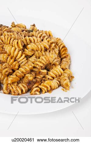 Close-up of spicy pasta in plate over white background View Large Photo Image Stock Image - Close-up of spicy pasta in plate over white background. Fotosearch