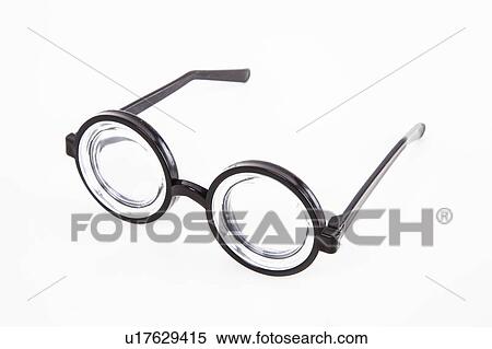 Close-up of thick glasses over white background View Large Photo Image Stock Photography - Close-up of thick glasses over white background. Fotosearch