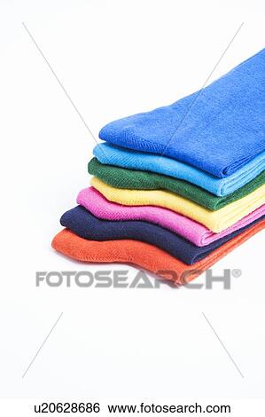 Colorful stack of folded socks over white background View Large Photo Image Stock Photograph - Colorful stack of folded socks over white background. Fotosearch