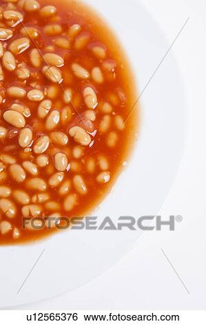 Stock Photograph - Cropped shot of plate full of beans. Fotosearch