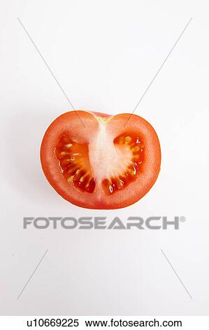 Cross section of tomato over white background View Large Photo Image Stock Photography - Cross section of tomato over white background. Fotosearch