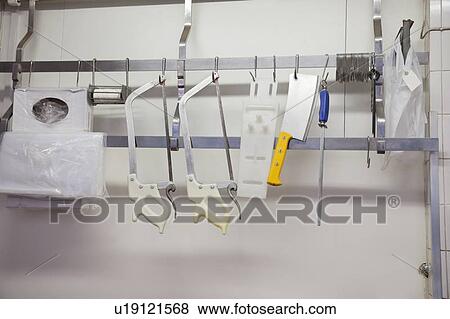 Equipment hanging at butcher shop View Large Photo Image Stock Photo - Equipment hanging at butcher shop. Fotosearch