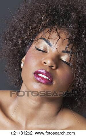 Stock Image - Extreme close-up of sensuous young African American woman. Fotosearch