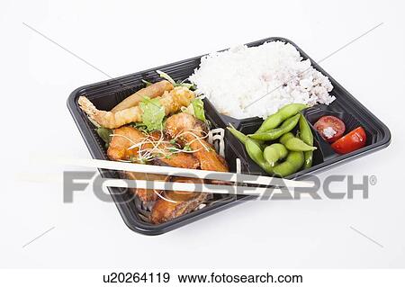 Healthy food served in Bento Box tray with chopsticks over white background View Large Photo Image Stock Photo - Healthy food served in Bento Box tray with chopsticks over white background. Fotosearch