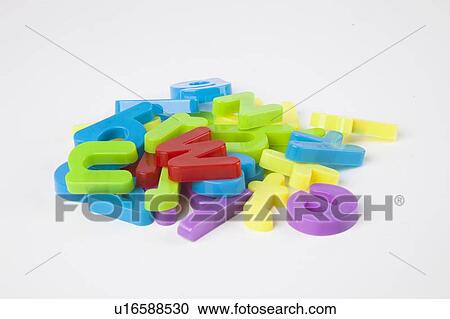 Pile of colorful alphabet magnets over white background View Large Photo Image Stock Image - Pile of colorful alphabet magnets over white background. Fotosearch
