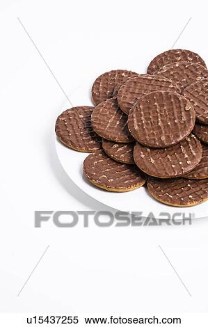 Plate full of chocolate biscuit over white background View Large Photo Image Stock Photography - Plate full of chocolate biscuit over white background. Fotosearch