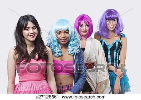 Portrait of beautiful young woman with females wearing wigs over white background View Large Photo Image Stock Image - Portrait of beautiful young woman with females wearing wigs over white background. Fotosearch