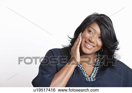 Stock Photograph - Portrait of casual mixed race woman over white background. Fotosearch