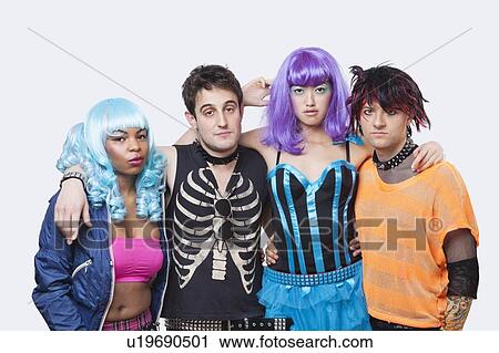 Stock Image - Portrait of four young punk group over white background. Fotosearch