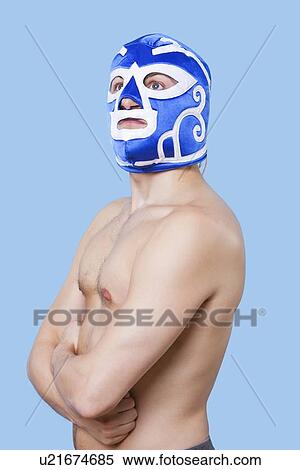 Portrait of topless man in wrestling mask gesturing over gray background View Large Photo Image Stock Photography - Portrait of topless man in wrestling mask gesturing over gray background. Fotosearch