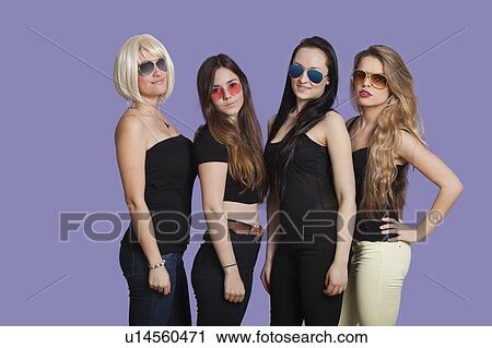 Portrait of two beautiful multi ethnic women smiling over purple background View Large Photo Image Stock Image - Portrait of two beautiful multi ethnic women smiling over purple background. Fotosearch