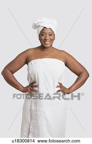Portrait of woman with body and head wrapped in towels over white background View Large Photo Image Picture - Portrait of woman with body and head wrapped in towels over white background. Fotosearch