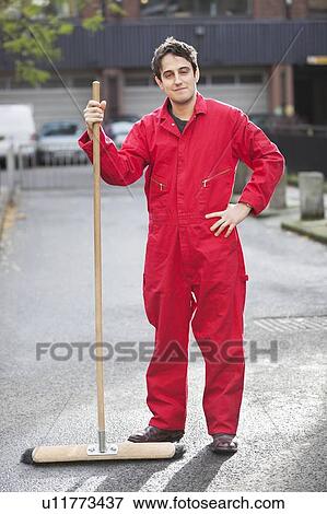 Portrait of young male street sweeper View Large Photo Image Stock Photo - Portrait of young male street sweeper. Fotosearch