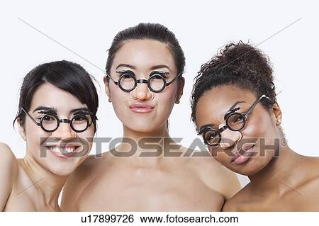 Portrait of young multi-ethnic women wearing groucho glasses over white background View Large Photo Image Stock Photograph - Portrait of young multi-ethnic women wearing groucho glasses over white background. Fotosearch