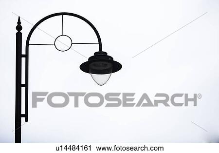 Side view of lamp against sky View Large Photo Image Stock Image - Side view of lamp against sky. Fotosearch