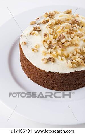 Walnut cake in plate over white background View Large Photo Image Stock Image - Walnut cake in plate over white background. Fotosearch
