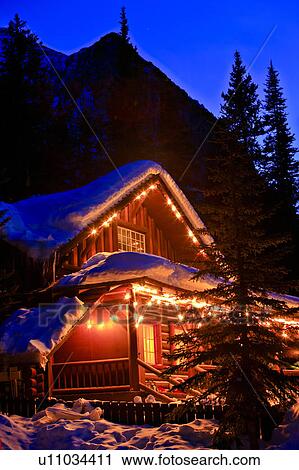 Log Cabin Covered In Snow Near The Shores Of Lake Louise Banff