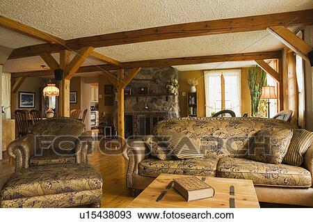 Pinewood Coffee Table Chest Chair And Sofa In The Living Room Of An Old Canadiana Circa 1821 Cottage Style Wooden Siding Residential Home Quebec