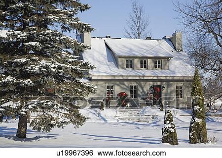 Residential Home With Christmas Decorations In Winter Quebec