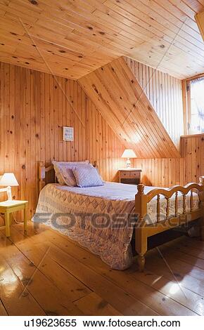 Bedroom On The Upstairs Floor Of A Canadiana Cottage Style