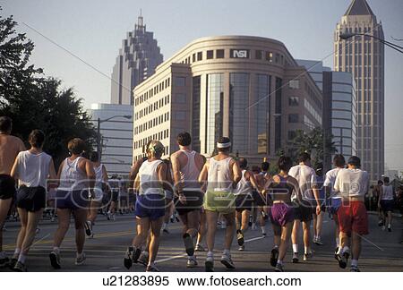 10K Peachtree Road Race, running, Atlanta, Georgia, A group of people running through Midtown in the Peachtree Road Race in Atlanta in the state of Georgia. View Large Photo Image Stock Photography - 10K Peachtree Road Race, running, Atlanta, Georgia, A group of people running through Midtown in the Peachtree Road Race in Atlanta in the state of Georgia.. Fotosearch